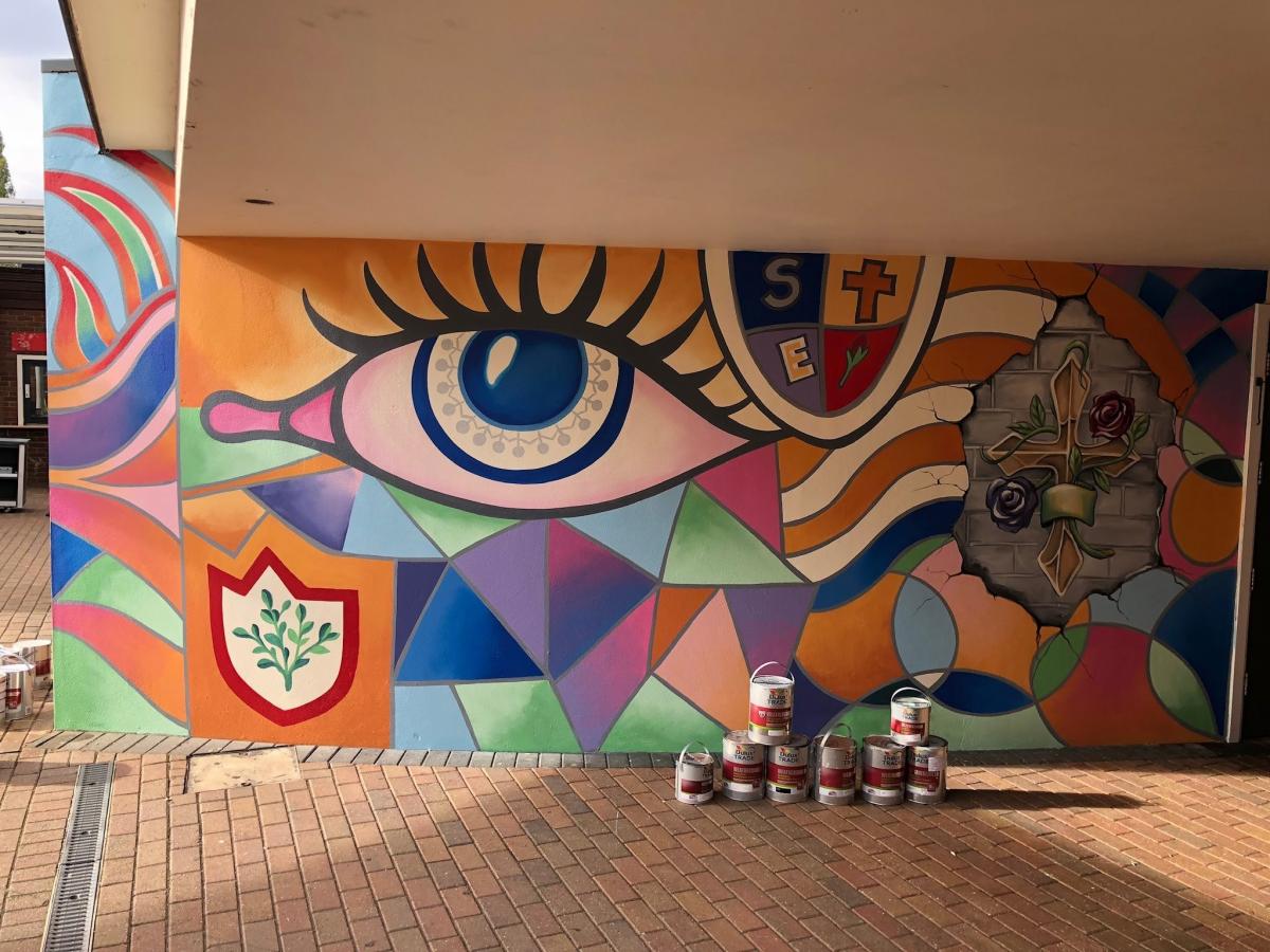 School mural painted using cheap and affordable recycled paint from Community RePaint scheme.