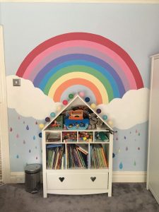 Rainbow painted in children's bedroom using paint from RePaint Bradford
