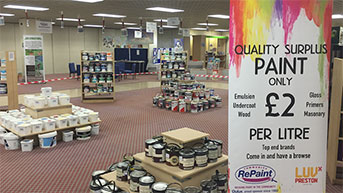 Paint display selling cheap and reusable paint at a Community RePaint Scheme.