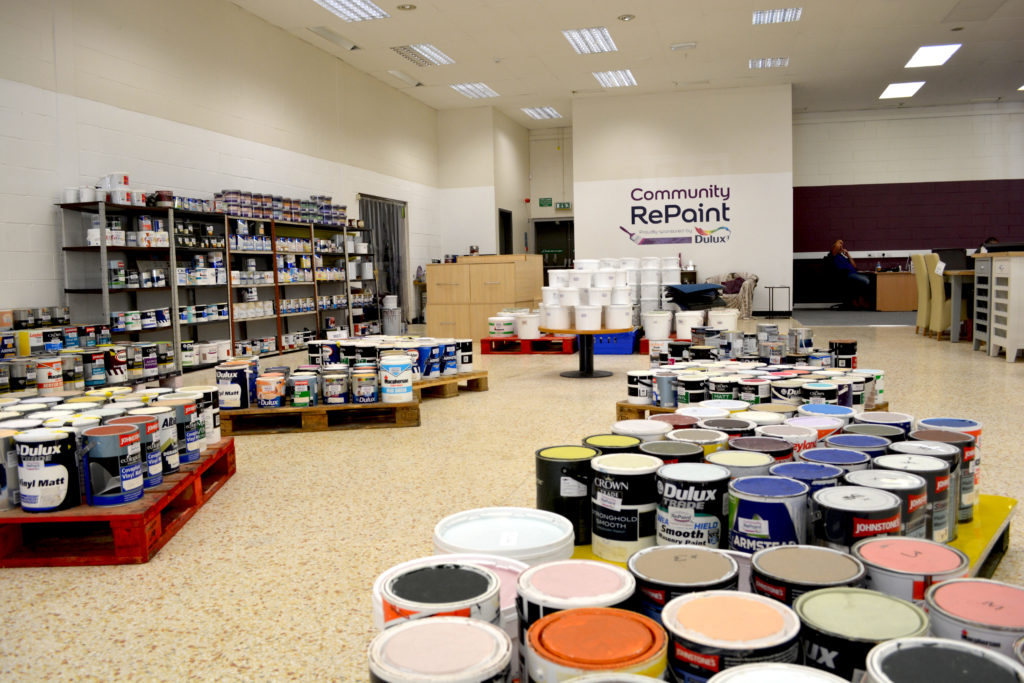 Paint display selling cheap and reusable paint at a Community RePaint Scheme.