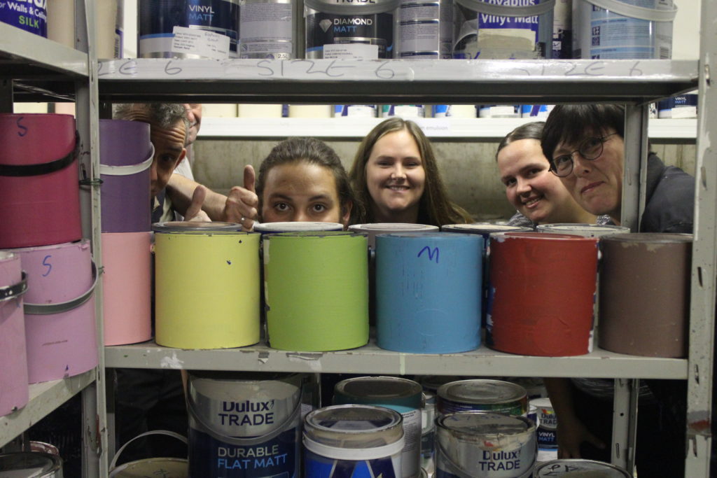 Paint display selling cheap and reusable paint at a Community RePaint Scheme.