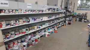 Paint display selling cheap and reusable paint at a Community RePaint Scheme.