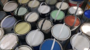 Paint display selling cheap and reusable paint at a Community RePaint Scheme.