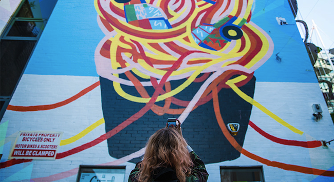 Community wall painted mural using cheap and affordable recycled paint from Community RePaint scheme.