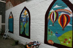 Community wall painted mural using cheap and affordable recycled paint from Community RePaint scheme.