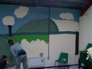 Community wall painted mural using cheap and affordable recycled paint from Community RePaint scheme.
