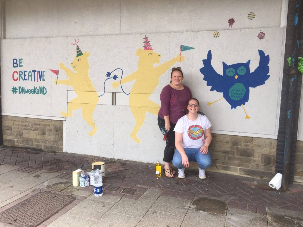 Community wall painted mural using cheap and affordable recycled paint from Community RePaint scheme.