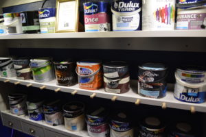 Paint display selling cheap and reusable paint at a Community RePaint Scheme.