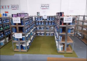 Paint display selling cheap and reusable paint at a Community RePaint Scheme.