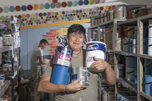 Community RePaint Bradford manager Karen Hutchinson and volunteer Lawrence Knowles process reusable paint. Dulux sponsor community RePaint.